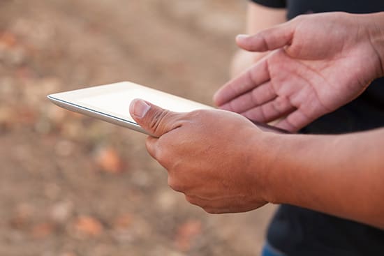 Hands holding tablet