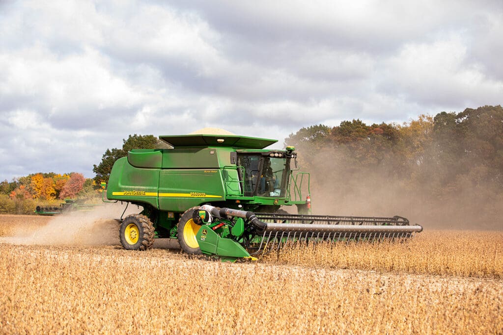 Combine harvesting mature soybean crop.